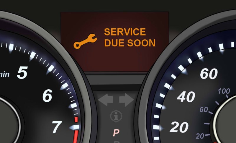service-light Service and oil change reminder light on a dashboard