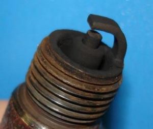 Carbon-fouled spark plug causing engine misfire