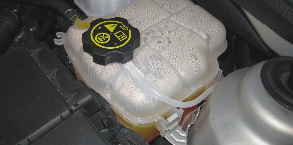 coolant-reservoir-hamilton-nz Coolant overflow reservoir under a car bonnet