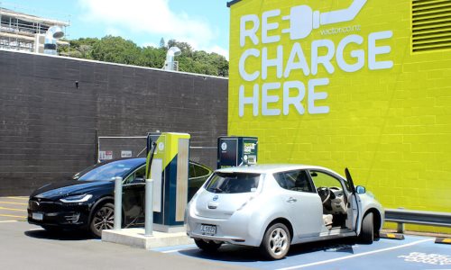 Electric cars plugged in and charging at a station