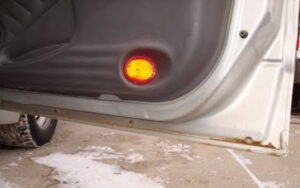Rust repair on a car door for a Warrant of Fitness
