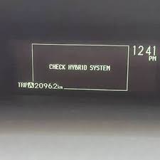 Dashboard display showing a Check Hybrid System warning