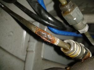 Close-up of a rusted brake pipe