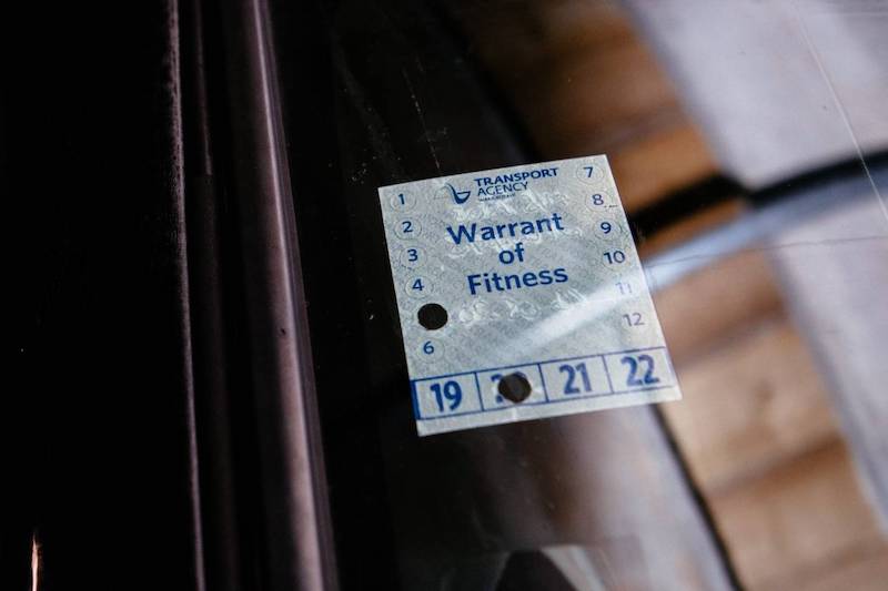 Warrant of Fitness label displayed on a windscreen