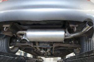 Exhaust fumes coming from a car exhaust pipe