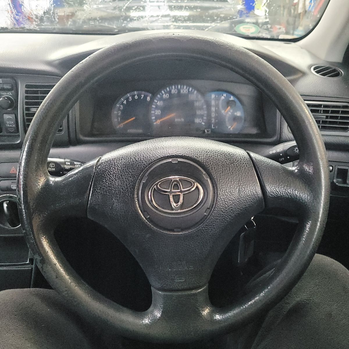 Toyota Airbag Steering Wheel Interior View Close-up of Toyota steering wheel with airbag in car interior
