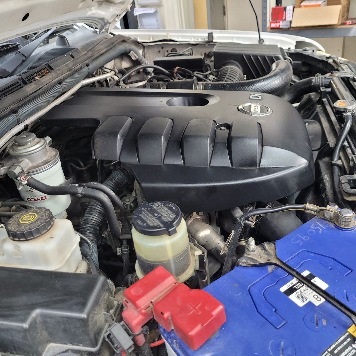 Close-up view of a diesel engine under the hood of a vehicle.