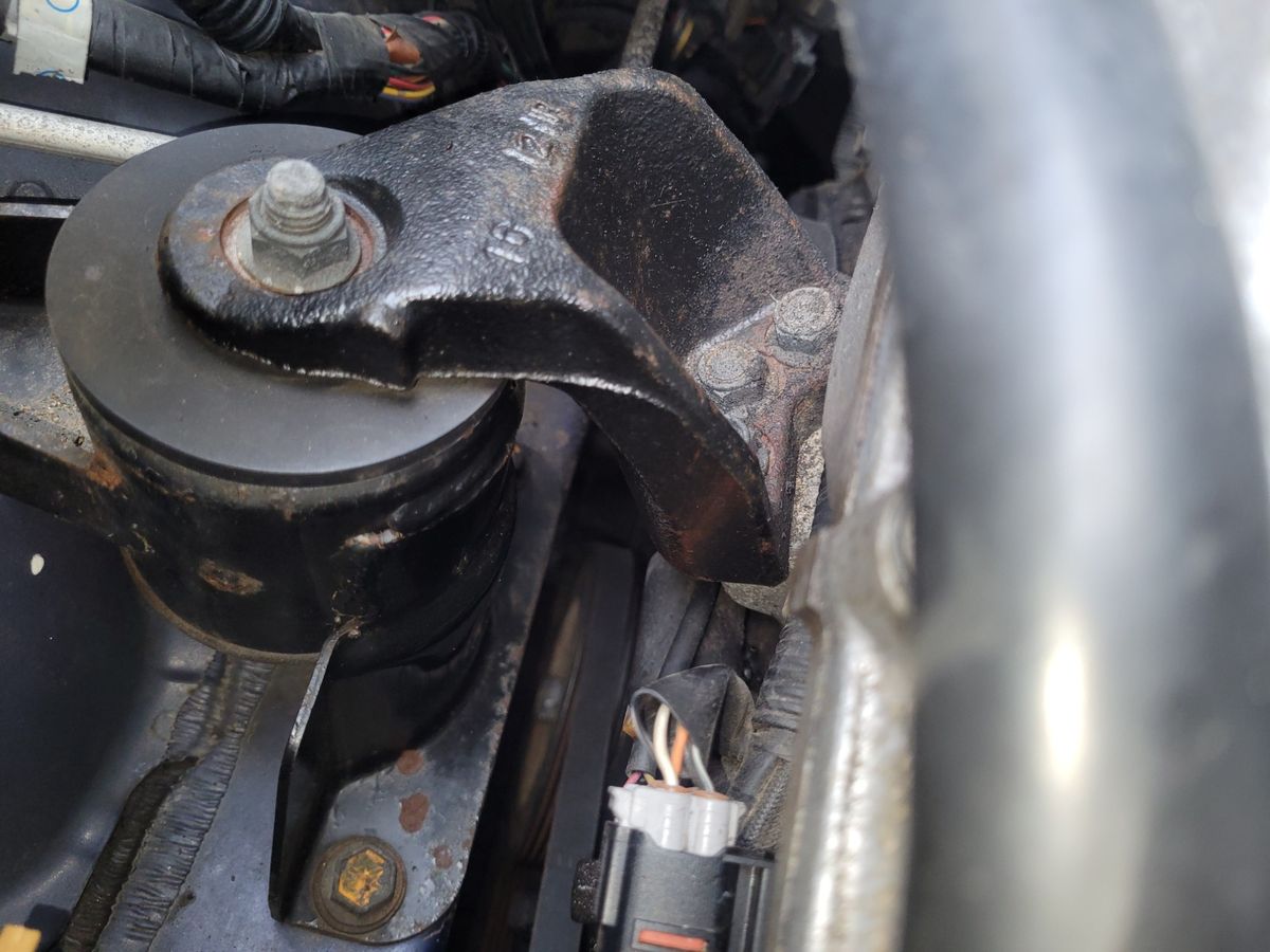 Close-Up of Car Engine Mount Detailed view of a car engine mount bolted in place