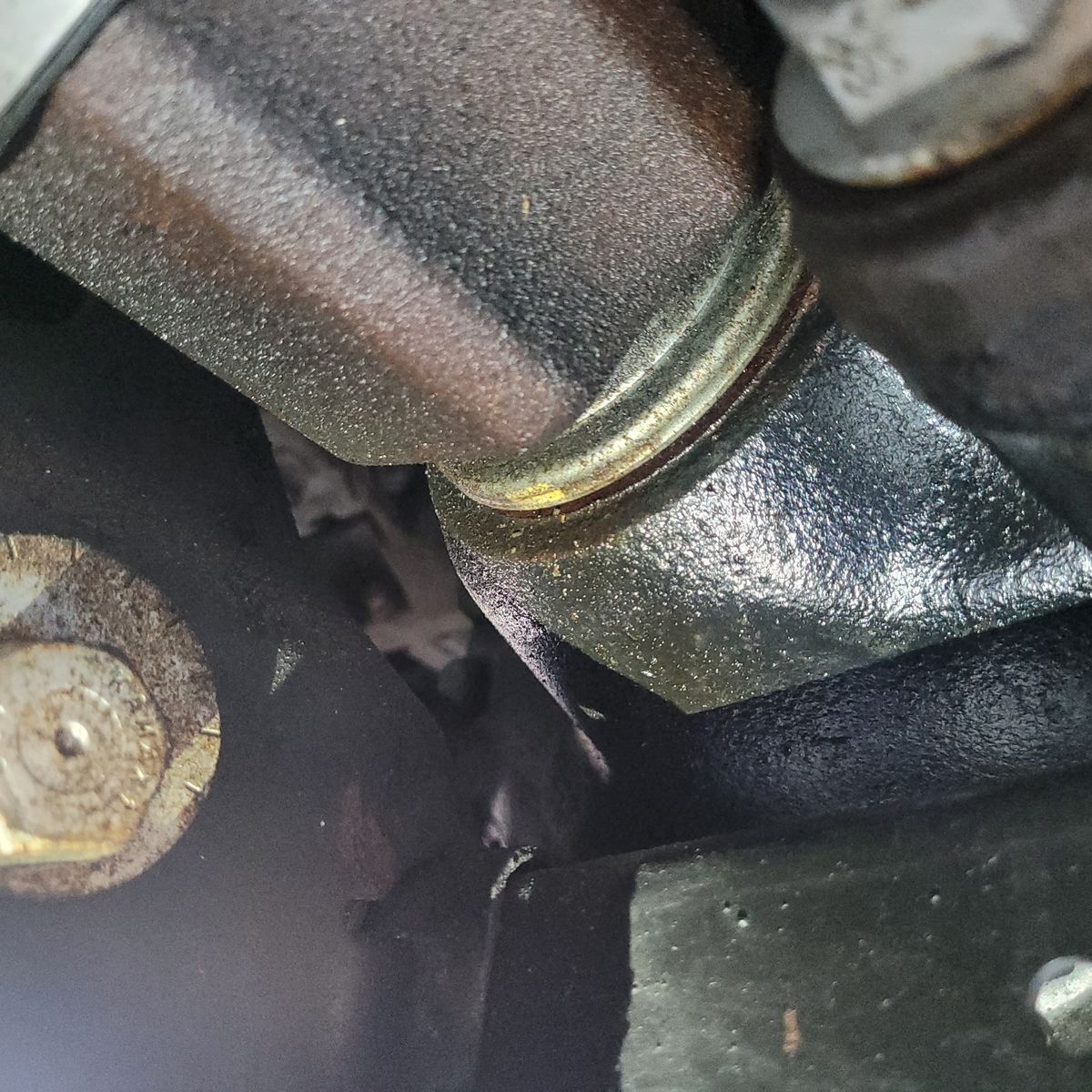 Close-Up of Front Left Axle Oil Seal Leak Leaking oil around front left axle oil seal area