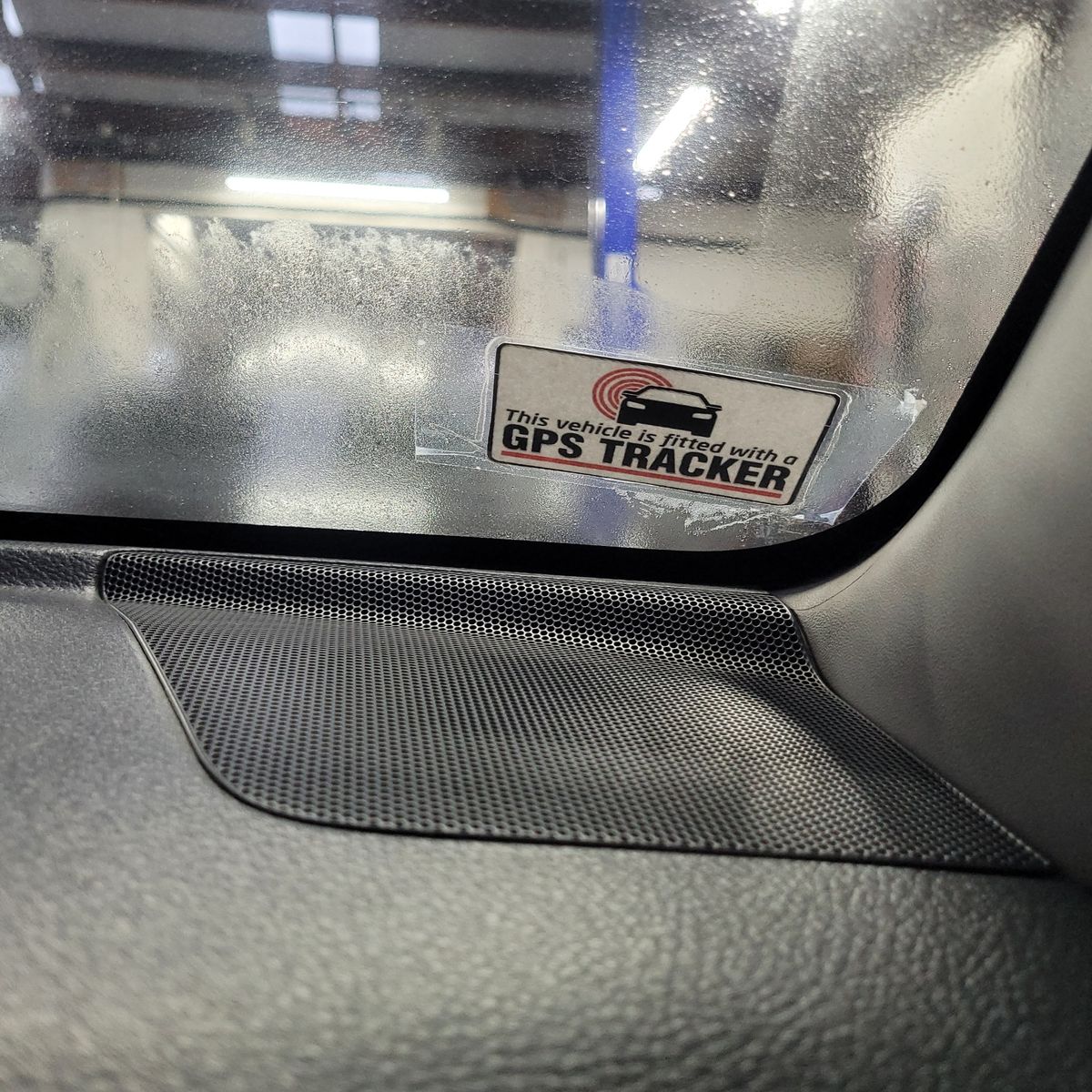 GPS Tracker Sticker on Car Window Sticker on car window reads: 'This vehicle is fitted with a GPS TRACKER.'