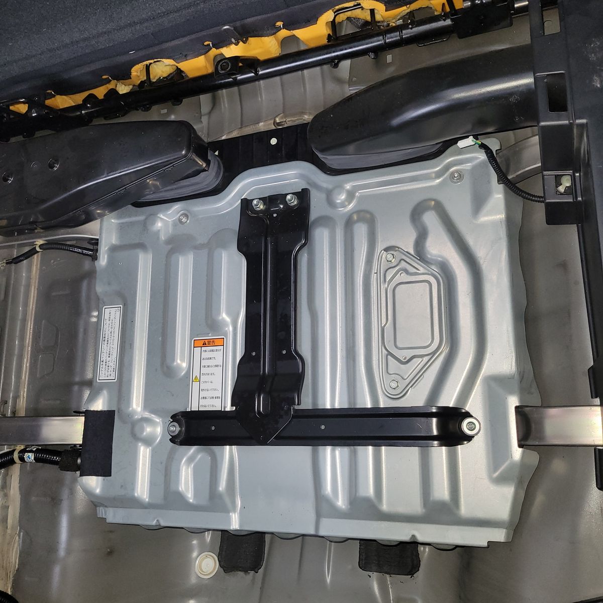 Hybrid Car Battery Installed Under Rear Seat Rectangular metal hybrid battery pack mounted inside vehicle frame