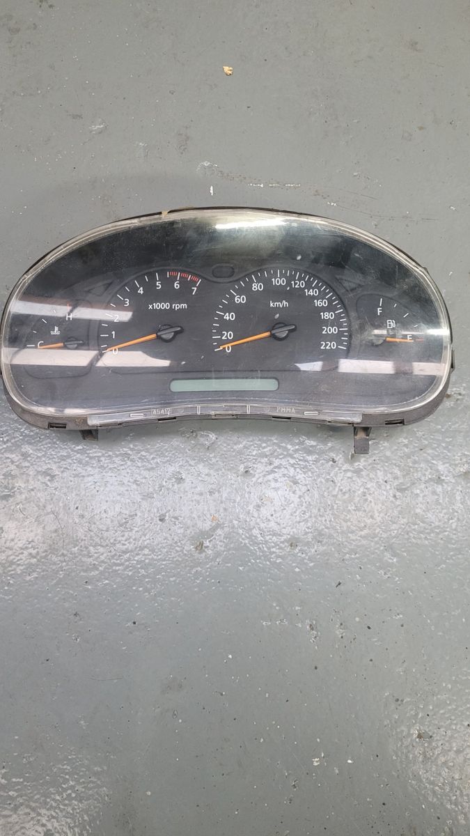 Analog Car Speedometer Cluster Disassembled car speedometer cluster with tachometer and fuel gauge