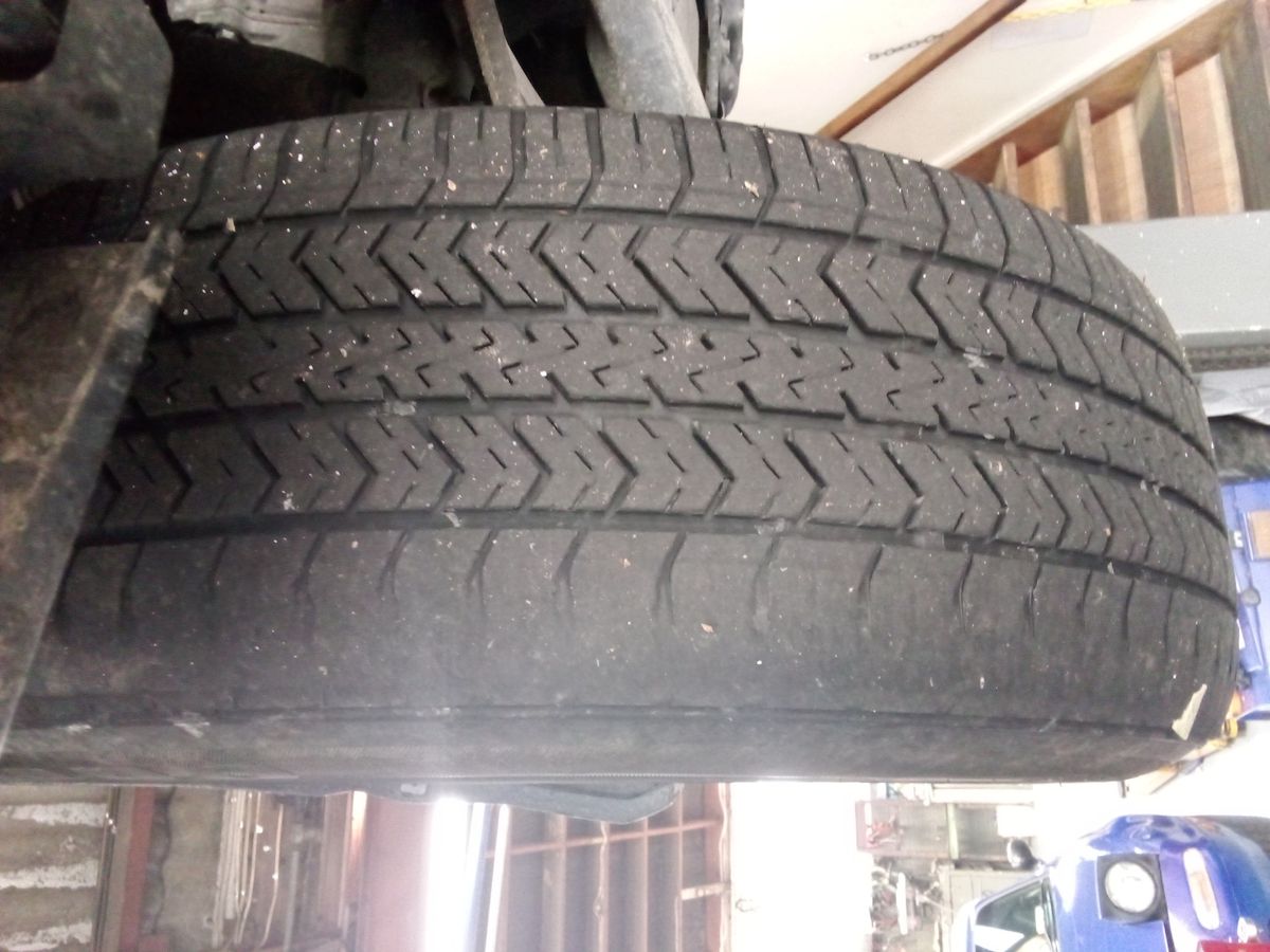 Tyre Worn on Outer Edge Close-up of a car tyre with significant wear on the outer edge
